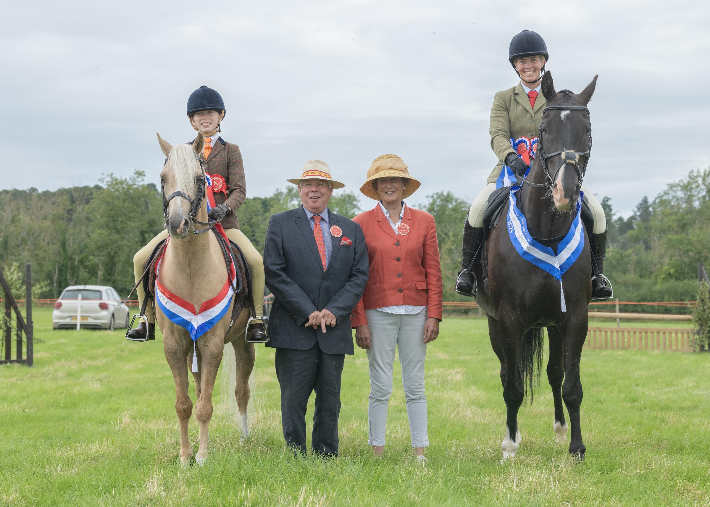 Supreme champion from Lexi Redpath, with judges Mr and Mrs I McKie, and reserve supreme from Abbie Riddell